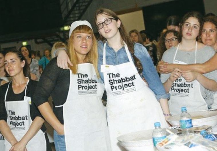 AROUND 2,400 women gather in an inner-Sydney warehouse for a mass bake-off to prepare halla for the 