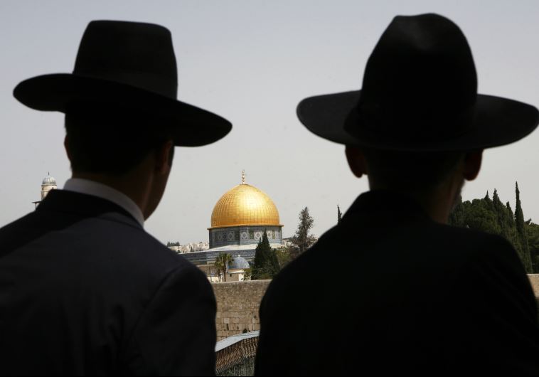 Ultra-Orthodox Jews look towards the Dome of the Rock in Jerusalem's Old City