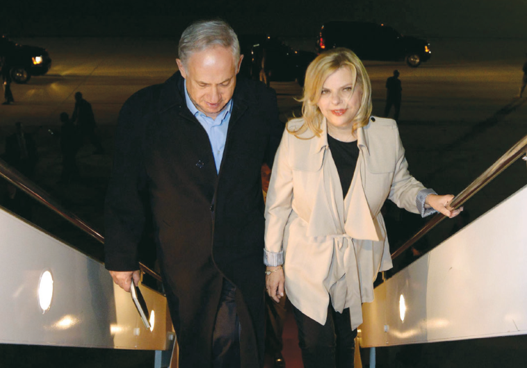 PRIME MINISTER Benjamin Netanyahu and his wife, Sara, board a plane in Washington early yesterday mo