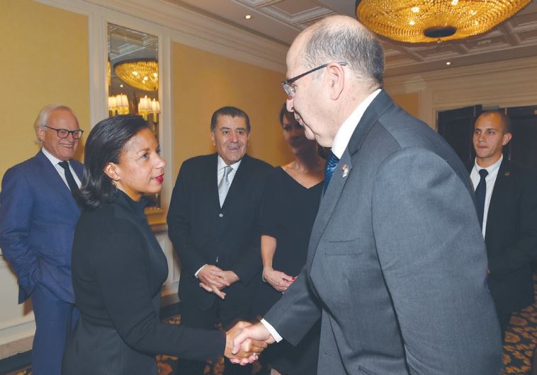 DEFENSE MINISTER Moshe Ya’alon shakes hands with US National Security Adviser Susan Rice