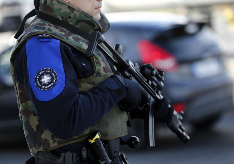 Swiss customs officer stands guard