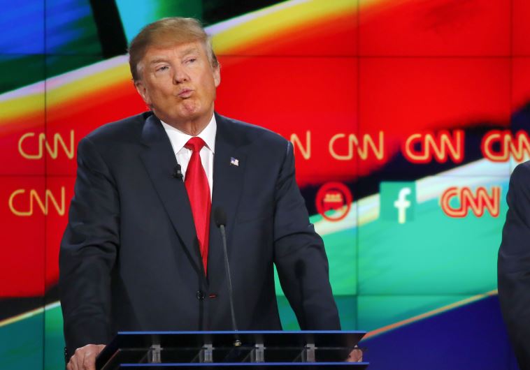 Republican U.S. presidential candidate businessman Donald Trump reacts during the Republican preside