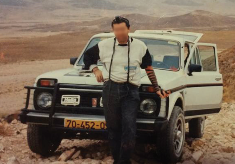 THIS MAN wearing phylacteries and leaning on the hood of an SUV is purportedly ‘Ezra Land Rover.’