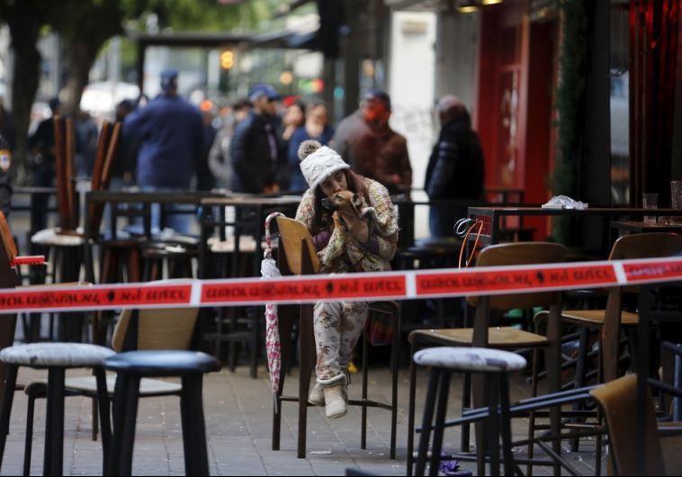 A police cordon is seen near the scene of a shooting incident in Tel Aviv
