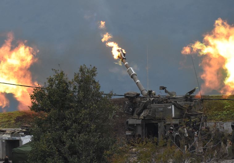 An IDF artillery gun fires a shell into Lebanon, after a roadside bomb exploded next to an IDF milit
