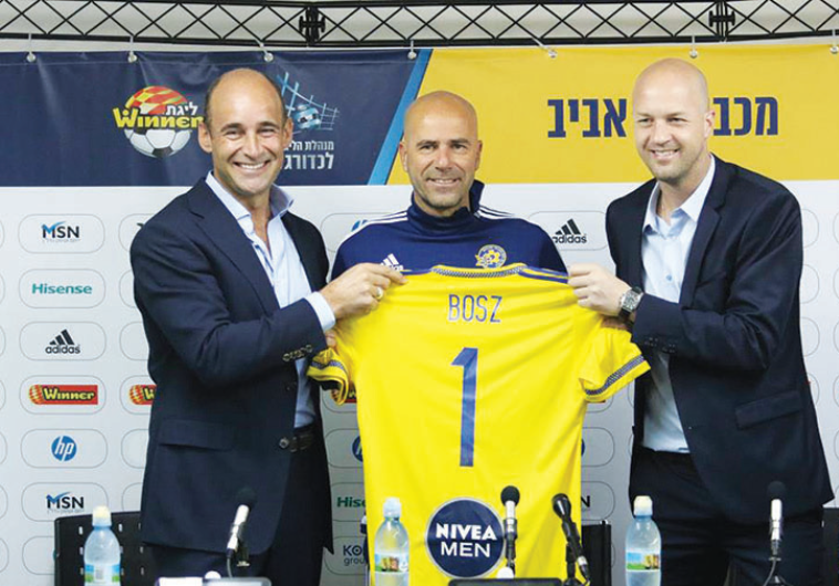 Peter Bosz (center) was unveiled as the new coach of Maccabi Tel Aviv by CEO Peter Bain (left) and s
