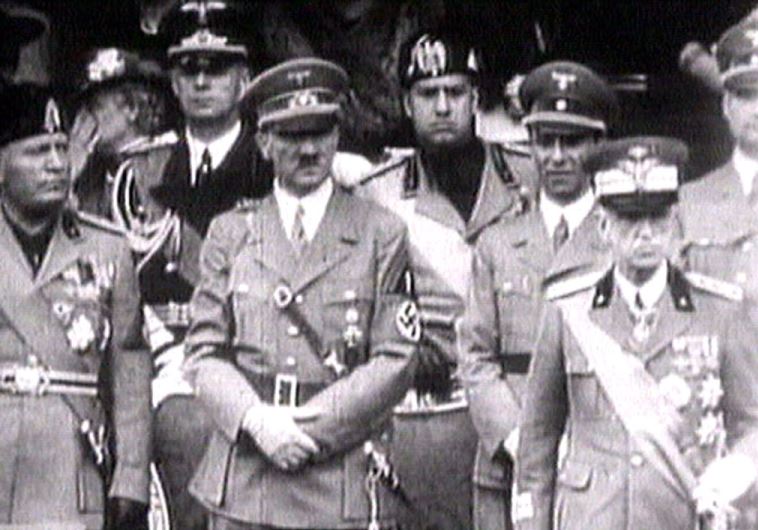 King Victor Emanuel III, (R) Adolf Hitler (C) and Benito Mussolini (L) watch fascist troops 