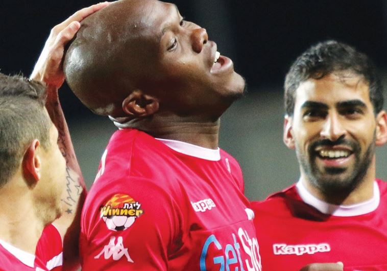 Hapoel Beersheba striker Anthony Nwakaeme (center) celebrates with teammates after scoring a goal