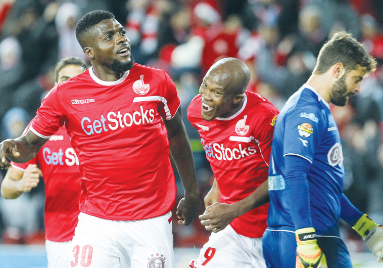 Hapoel Beersheba midfielder John Ogu (left) celebrates after scoring his team’s second goal in last 