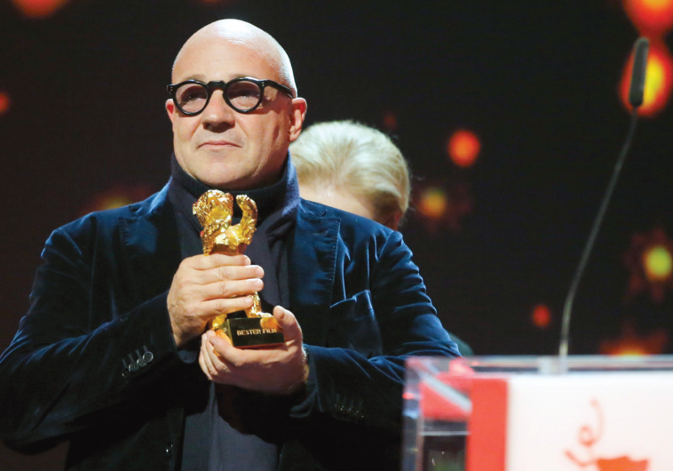 DIRECTOR GIANFRANCO ROSI receives the Golden Bear – Best Film award for the movie ‘Fire at Sea’ at t