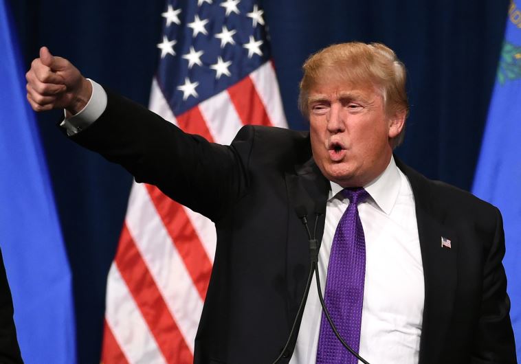 Republican presidential candidate Donald Trump speaks at a caucus night watch party at the Treasure 