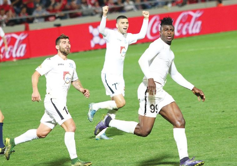 Hapoel Acre striker Lanry Kahinda (right) celebrates after scoring his second goal in last night’s 2
