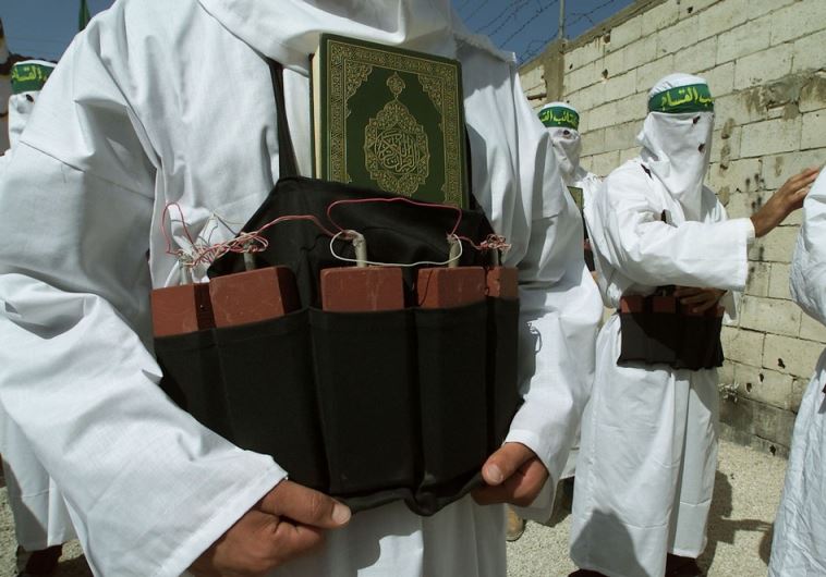 A Palestinian from the Islamic group Hamas wears a belt of simulated explosives