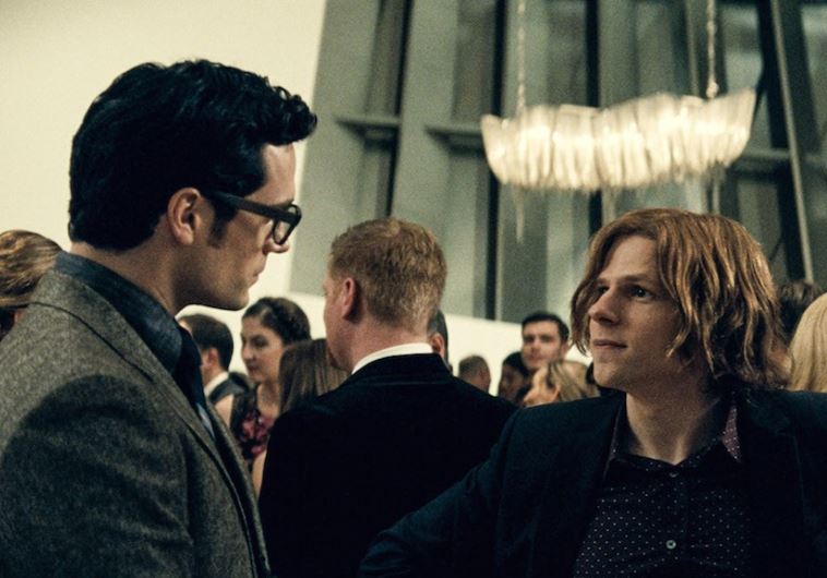 Henry Cavill, left, as Clark Kent, and Jesse Eisenberg as Lex Luthor in “Batman v. Superman: Dawn of