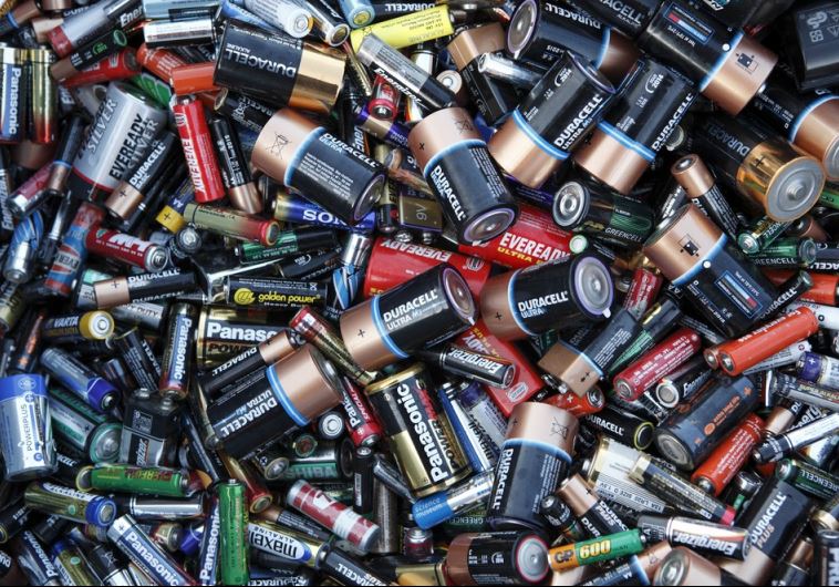 Batteries sit in a collection box at a recycling center in London