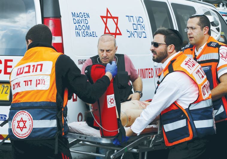 MDA MEDICS evacuate a Palestinian attacker in Jerusalem after a stabbing in October