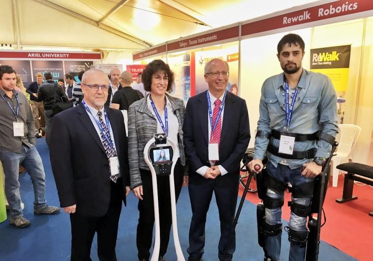 A representative for the company Rewalk (R) stands iwth Prof. Moshe Shoham, Dr. Sigal Berman and Pro