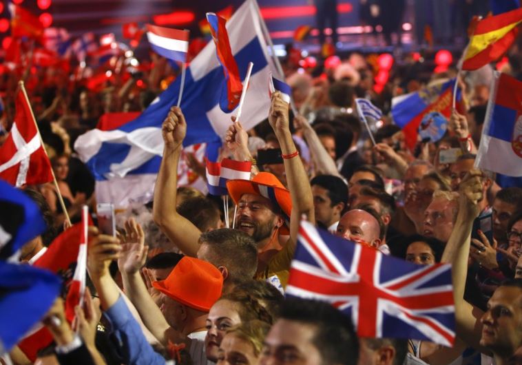 Fans wave flags during the Eurovision song contest in Vienna, May 19, 2015