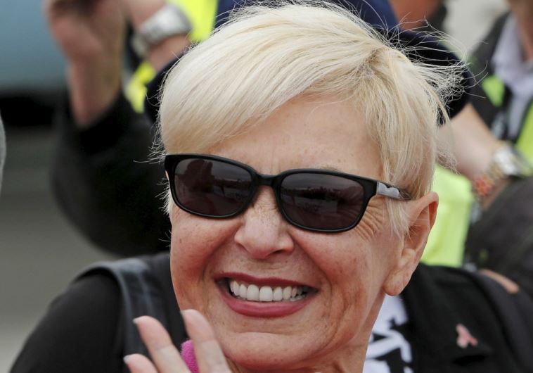 Actress Roseanne Barr poses upon her arrival for the Life Ball at the airport in Vienna