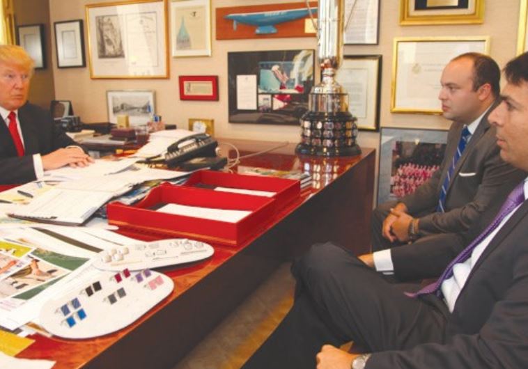REPUBLICAN PRESIDENTIAL candidate Donald Trump talks in his office to Ambassador to the UN