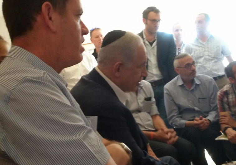 PM Netanyahu at family home of slain teenage terror victim in Kyriat Arba