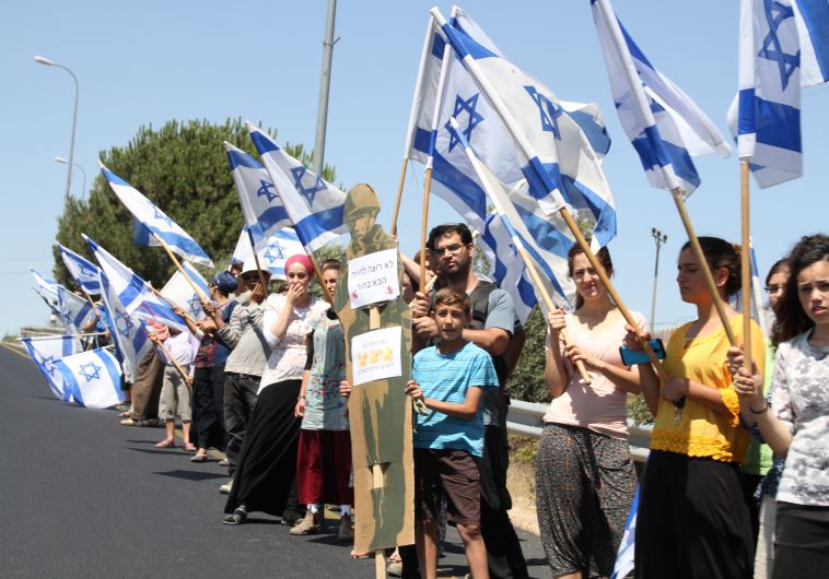 Israelis along Route 60 on day of Mark funeral.
