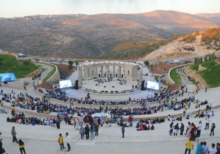 MUSIC LOVERS arrive for the Id al-Fitr concert at the new amphitheater in Rawabi, north of Ramallah,