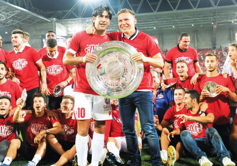 After winning a historic championship last season, Hapoel Beersheba, led by coach Barak Bachar (hold