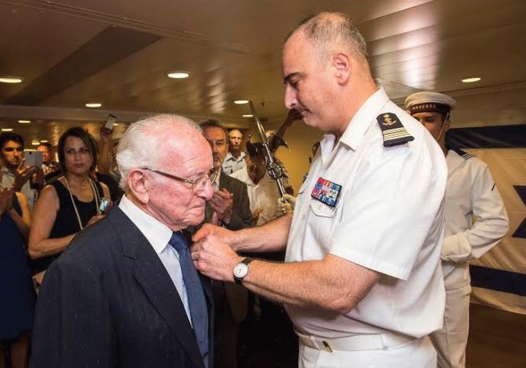 DR. RENE KARAT receives the French Legion of Honor from Captain Laurent Sudrat in Haifa.