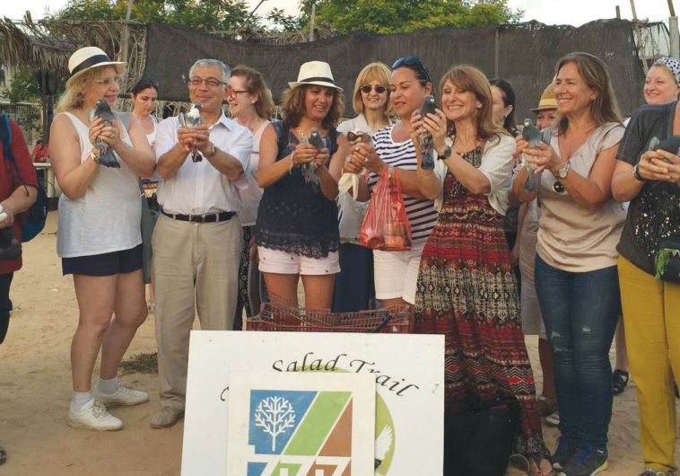 EDUCATORS FROM France and Belgium pose with doves on a visit last week to the Hebesor Region ‘Salad 