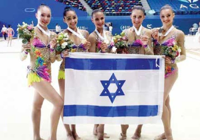 The members of Israel’s rhythmic gymnastics national team pose with the gold medals they won yesterd