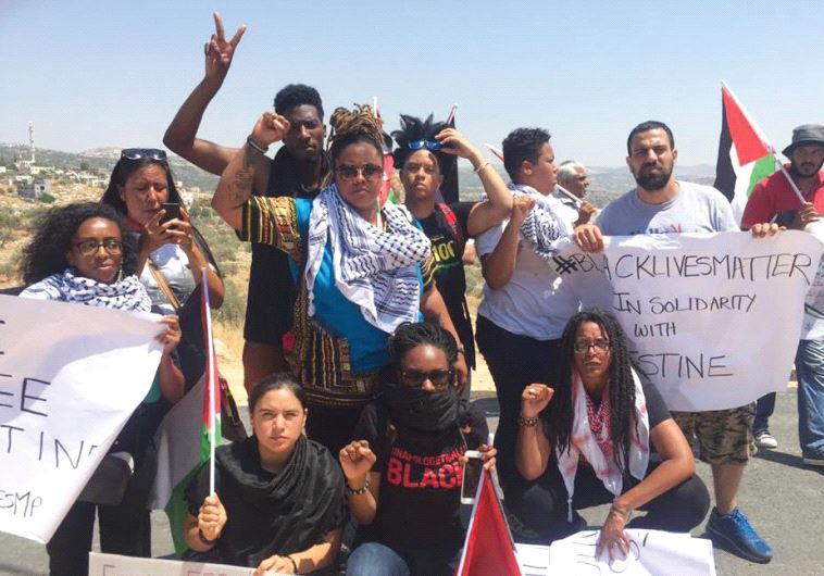 BLACK LIVES MATTER activists pose in Bil’in, a Palestinian village west of Ramallah on Friday.
