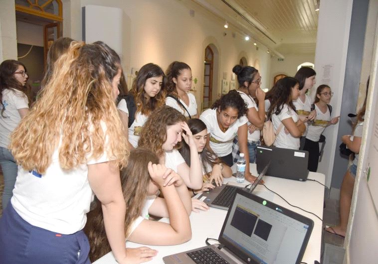 Teen girls study at a cyber-tech summer camp in Beersheba 