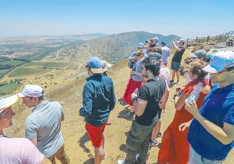 CIJO MISSION PARTICIPANTS view Syria from the Golan Heights, where they heard explosions from the ne