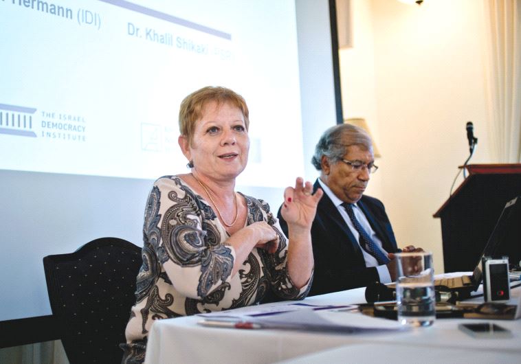PROF. TAMAR HERMANN and Dr. Khalil Shikaki speak at this week’s press conference about a poll carrie