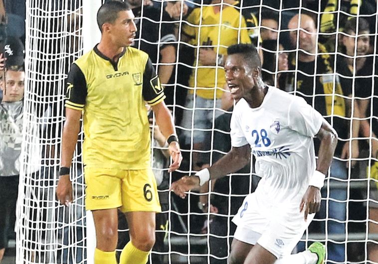 Ironi Kiryat Shmona midfielder Didier Brossou (right) celebrates after netting a 94th-minute equaliz