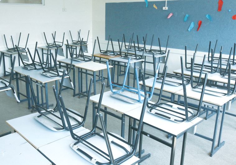 A CLASSROOM awaits its pupils.