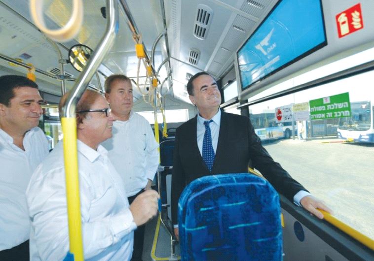 TRANSPORTATION MINISTER Israel Katz takes a ride yesterday in one of Tel Aviv’s new Dan electric bus