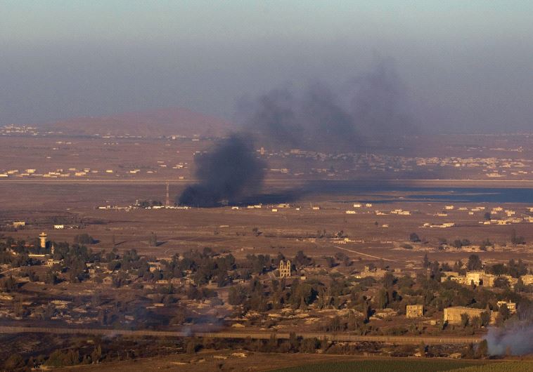 IS DETERRENCE working? Smoke rises last year on the Syrian side of the Golan Heights during fighting