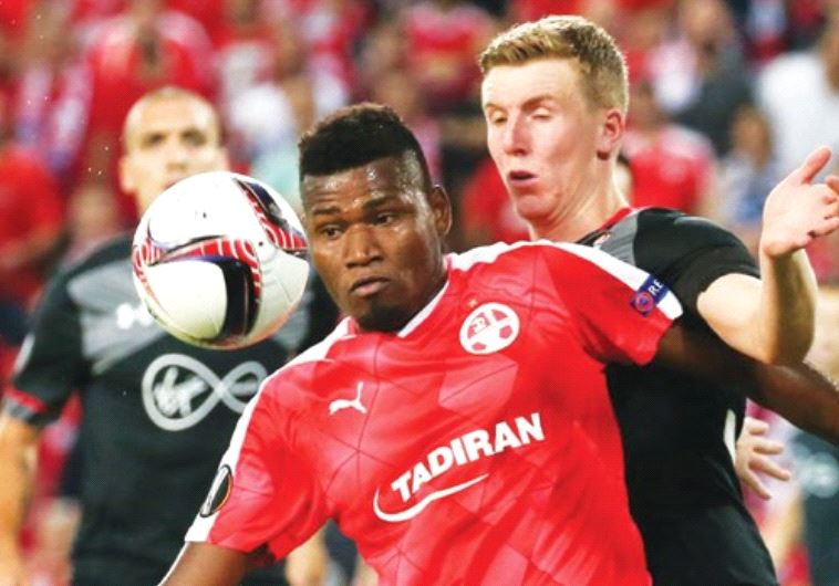 Hapoel Beersheba striker Lucio (front) battles Southampton’s Matt Targett during last night’s goalle