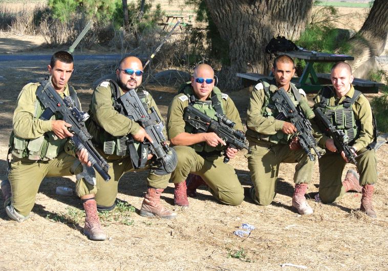 SOLDIERS FROM the Desert Reconnaissance Battalion pose for a group portrait on October 3. They inclu