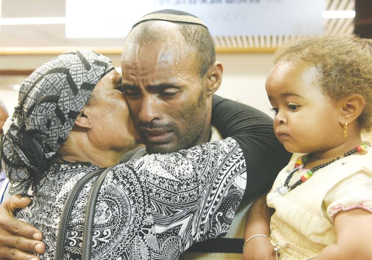 ETHIOPIAN IMMIGRANTS are greeted by loved ones at Ben-Gurion Airport on Sunday