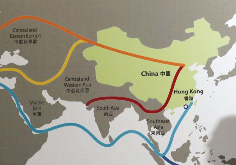 THE SHADOW of a participant is seen on a map illustrating China’s ‘One Belt, One Road’ megaproject a