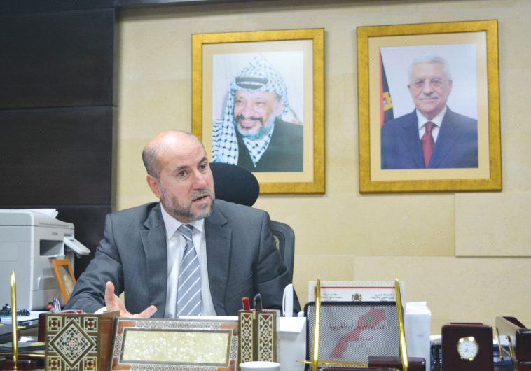 MAHMOUD AL-HABASH, top adviser to PA President Mahmoud Abbas, responds to questions during an interv