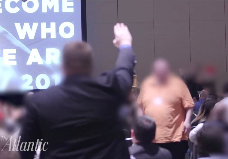 A supporter of the alt-Right giving a Nazi salute.
