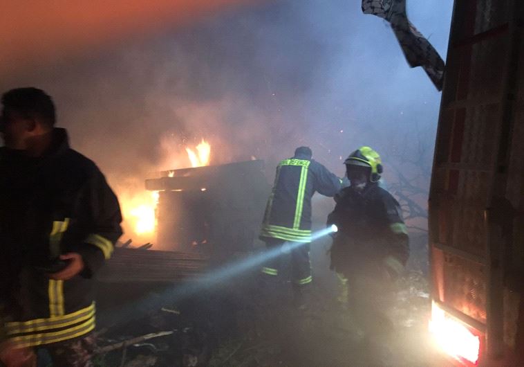 Palestinian firefighters help to put out fires in Israel 