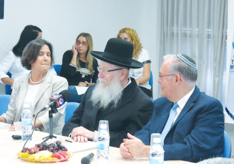 HEALTH MINISTER Ya’acov Litzman is flanked by Prof. Jonathan Halevy and Dr. Osnat Luxenburg at a mee