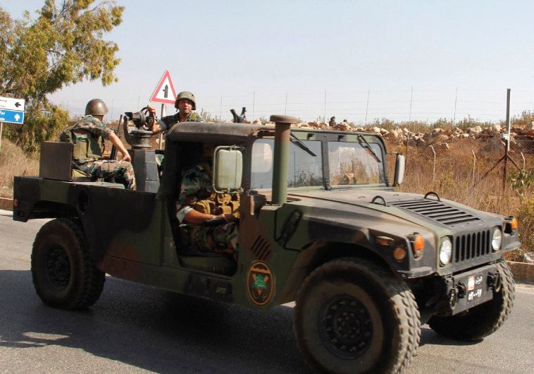 LEBANESE SOLDIERS drive near the border with Israel in Kafr Kila, in October. Israel has used its ab