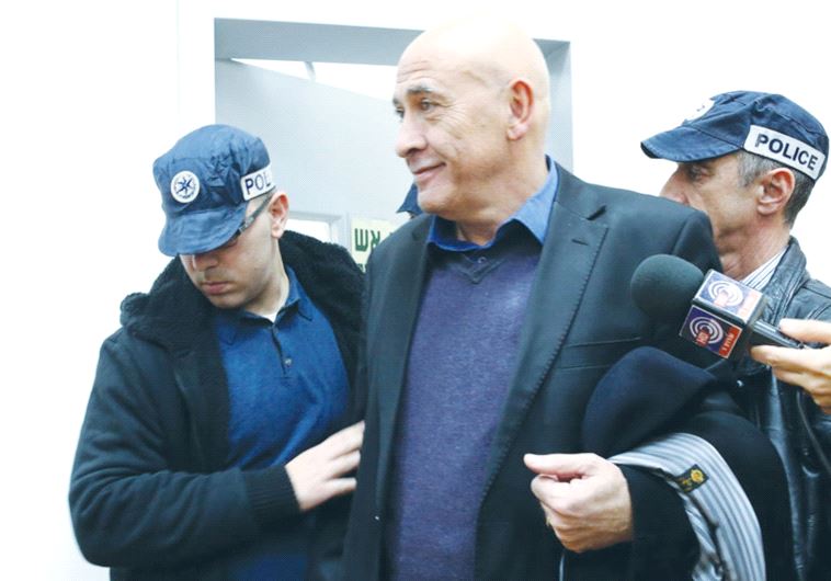 BALAD MK Basel Ghattas being brought to Rishon Lezion Magistrate Court yesterday, where Judge Moshe 