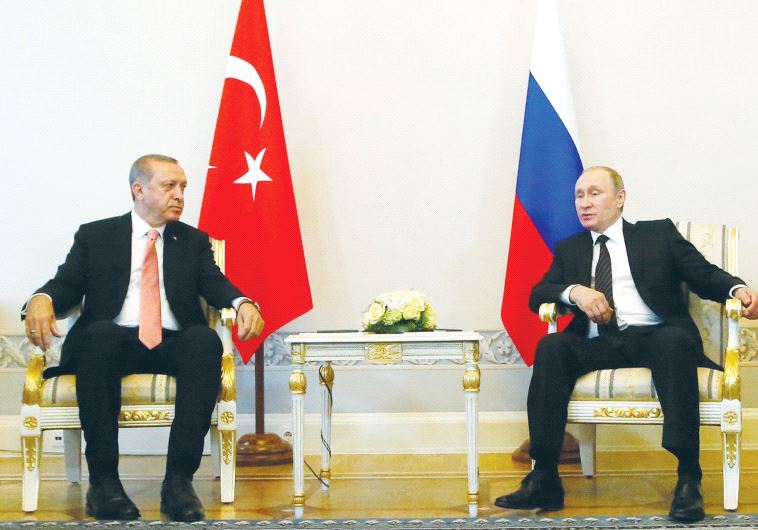 RUSSIAN PRESIDENT Vladimir Putin (right) speaks to Turkish President Recep Tayyip Erdogan during the